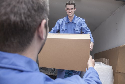 Loading furniture into a moving truck in Bow