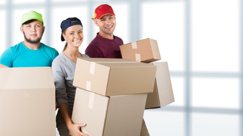 Packed moving boxes and furniture ready for transport