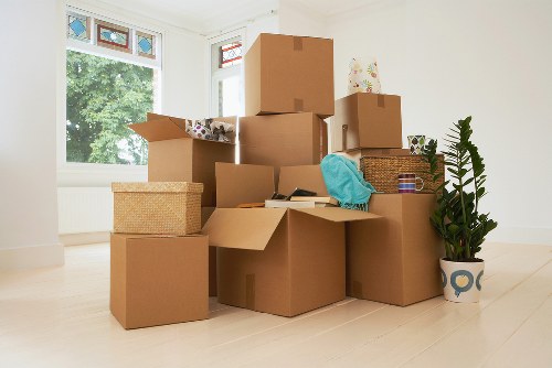 Packed boxes and household items ready for removal in Bow
